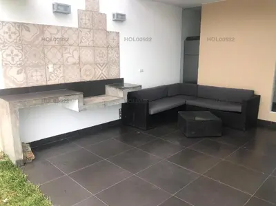 a living room with a couch and a table at Casa en Asia in Asia