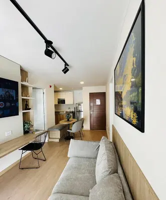 a living room with a couch and a table at Modern 2Br Apt Fully Furnished Barranco in Lima