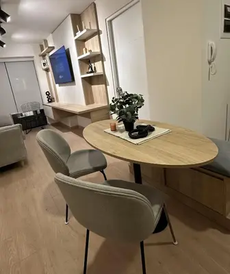 a living room with a table and chairs and a couch at Modern 2Br Apt Fully Furnished Barranco in Lima