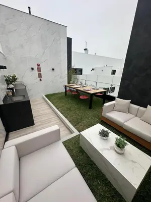 a living room with a couch and a table at Departamento amoblado de 1 dormitorio in Lima
