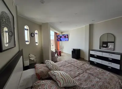 a bedroom with a bed and a dresser and a mirror at Miramar Vip in Barranca