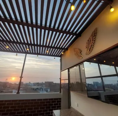 a building with a wooden ceiling and windows with a view at Miramar Vip in Barranca