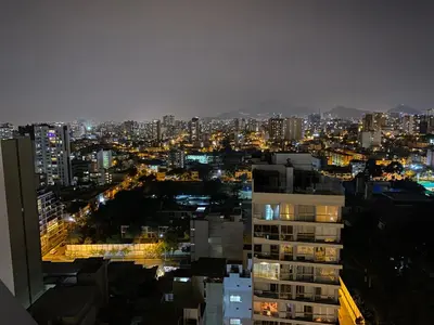 a view of a city at night at Vista piso 24 in Lima