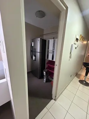 a hallway with a refrigerator in a room at Comodidad y Exclusividad in Lima