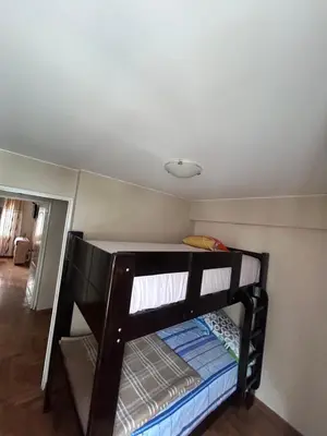 a bunk bed in a room with a ceiling at Comodidad y Exclusividad in Lima