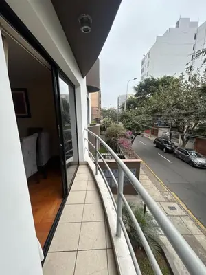 a balcony with a view of a city street at Comodidad y Exclusividad in Lima
