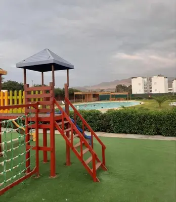 a playground with a gazebo on top at Duplex con piscina en Asia in Asia