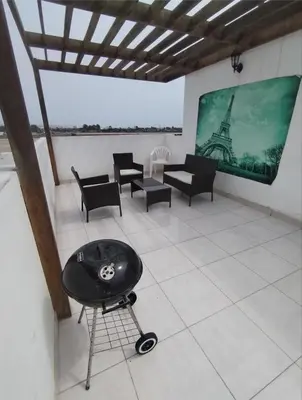 a room with chairs and a screen with the eiffel tower at Duplex con piscina en Asia in Asia