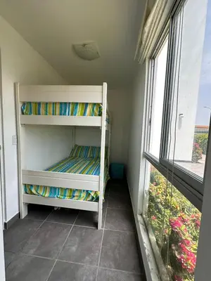 a bunk bed in a room with a window at Mirador 101 in Asia