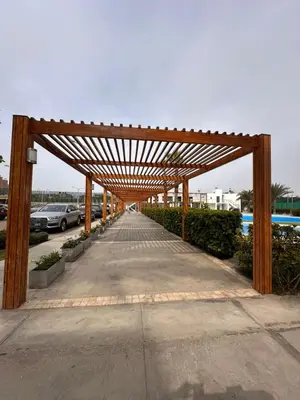 a wooden pergola over a parking lot at Mirador 101 in Asia