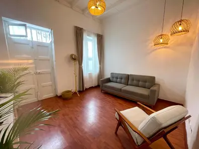 a living room with a couch and a chair at Entire House close to the sea Miraflores in Lima
