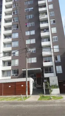 a tallartment building with a building at Temporal Apartment in Lima