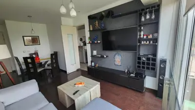 a living room with a couch and a table at Apartamento de Lujo in Lima