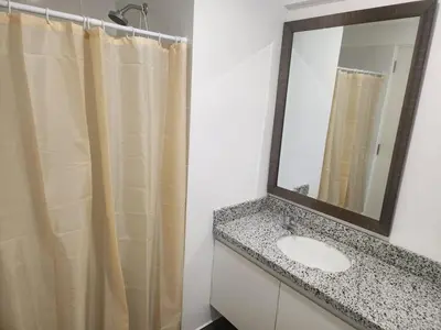 a bathroom with a sink and a mirror at Apartamento en Lima in Lima