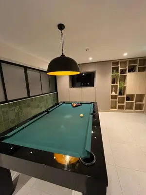a pool table in a living room with a light at Luxury Barranco Pool Zoe in Lima