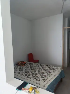 a bed in a room with a mirror at departamento frente al mar in San Bartolo