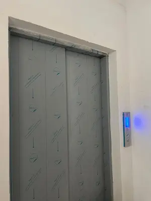 two metal lockers in a room with a blue light at Mirador del sur in San Bartolo