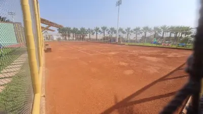 a tennis court with a net on a tennis court at Casa de Playa Familiar in Puerto Viejo