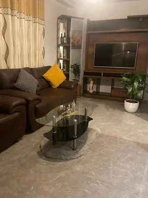 a living room with a couch and a coffee table at Hermoso Departamento en el mejor sector de Ica in Ica