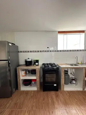 a kitchen with a stove and a refrigerator at San Bartolo house rental in San Bartolo