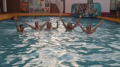 a group of girls in a swimming pool at Hospedaje snack bar titanic in Ica