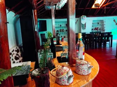 a table with two bottles of wine on it at Andenes del Inca Hotel in Ollantaytambo