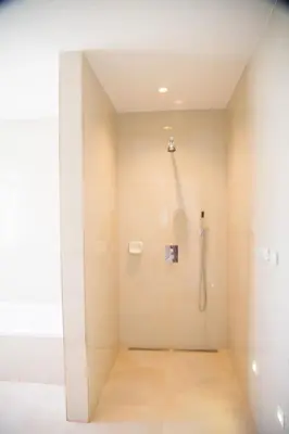 a bathroom with a shower in a room with at Edelweiss Haus in Chontabamba