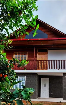 a house with a porch and a balcony at Edelweiss Haus in Chontabamba