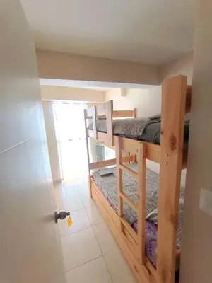a room with two bunk beds in it at Departamento Playa Arica - Lurín in Lurín