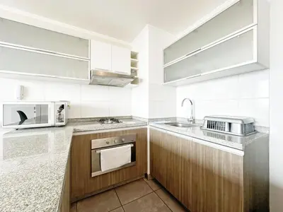 a kitchen with a sink and a microwave at Moderno Dpto , Equipado, Céntrico, Vista Increible in Lima