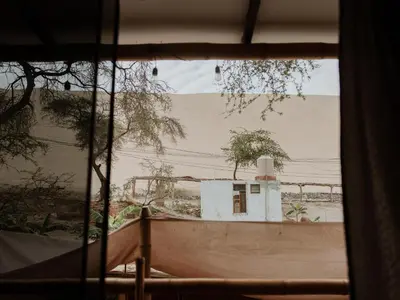 a view of a building from a window at HOSPEDAJE CasaBlanca Huacachina in Ica