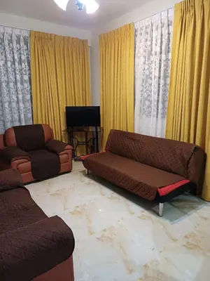 a living room with two couches and a couch at Family accommodation in Lima