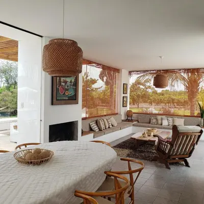 a living room with a table and a couch at Casa de Campo con lago en Mala in Mala