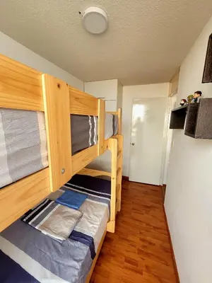a bedroom with two bunk beds in a room at Modern and comfortable apartment nearby Aairport in Lima