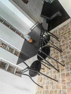 a black stove top in a kitchen next to a fireplace at Residencial Misky Dreams in Huánuco