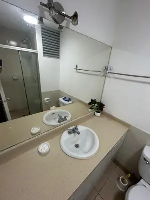 a bathroom with a sink and a mirror at Departamento en Miraflores, Lima 3HAB in Lima