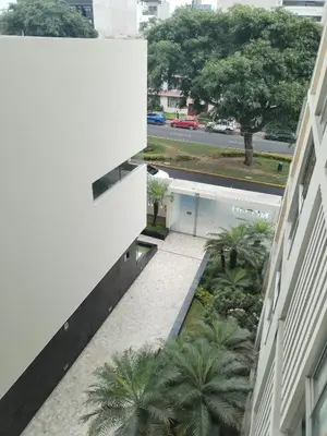 an overhead view of a building with palm trees at Departamento en Miraflores, Lima 3HAB in Lima
