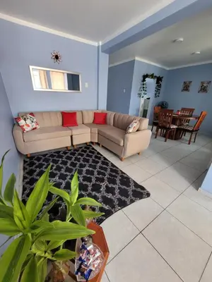 a living room with a couch and a table at AlojamientoMarín in Lima