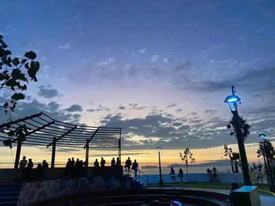 a group of people standing at a skate park at sunset at Departamento in Magdalena del Mar in Lima