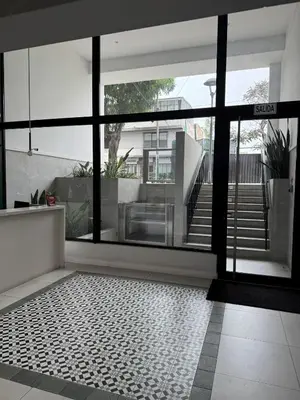 a room with a large window and a tile floor at Exclusive apartment Barranco! in Lima