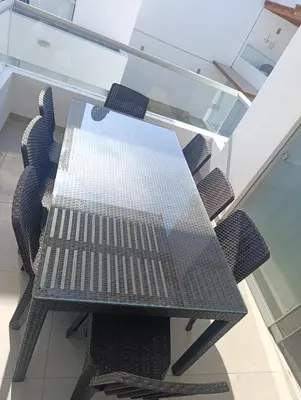 a glass table and chairs in an office at casa en playa de condominio mikonos in Asia