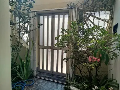 an open door in a room with plants at Apart Hotel Valdelomar in Ayacucho