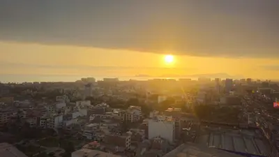a view of a city with the sun setting at Departamento con Increíble ubicación en San Miguel in Lima