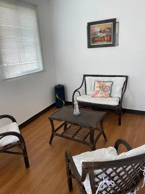 a living room with a couch and a coffee table at Lindo departamento muy cerca a la playa in Punta Negra