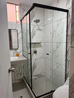 a bathroom with a glass shower with a sink at Casa de Playa - Asia - SELENE beach house in Asia