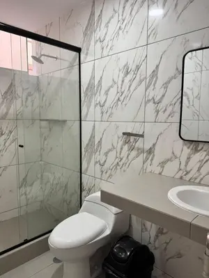 a bathroom with a toilet and a sink and a mirror at Casa de Playa - Asia - SELENE beach house in Asia