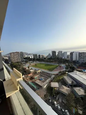 a view of a city from the balcony of a building at Inca inn apartments in Lima