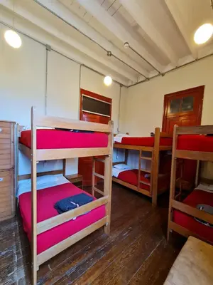 a group of bunk beds in a room at Flying Dog Hostel in Lima