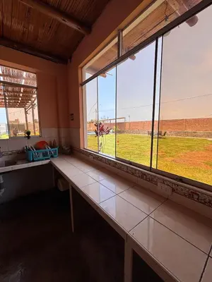 a room with a bench in front of a window at Casa Puente Azul - Casa de Playa in Cerro Azul