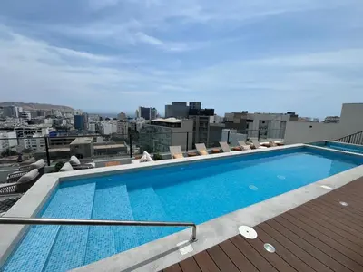 a swimming pool on the roof of a building at INTI Studio Apartment in Lima